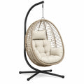 Fauteuil suspendu de jardin Abrenvo en résine tressée beige avec support métallique noir, dimensions 105x105x195 cm.