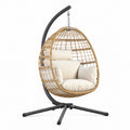 Fauteuil suspendu en rotin tressé et acier noir, style bohème, avec support, dimensions 105x105x195 cm, par Abrenvo.